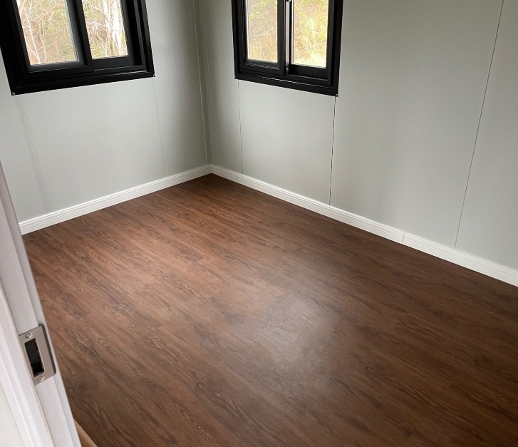 20ft high ceiling with finished skirting and hybrid flooring